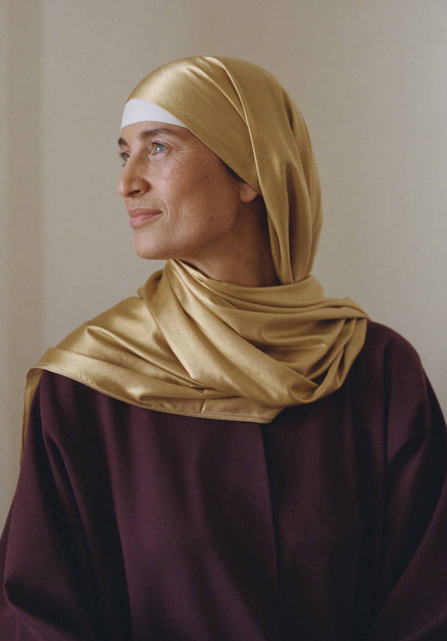 An Arab woman in her fifties, calm and confident, finding her direction through menopause